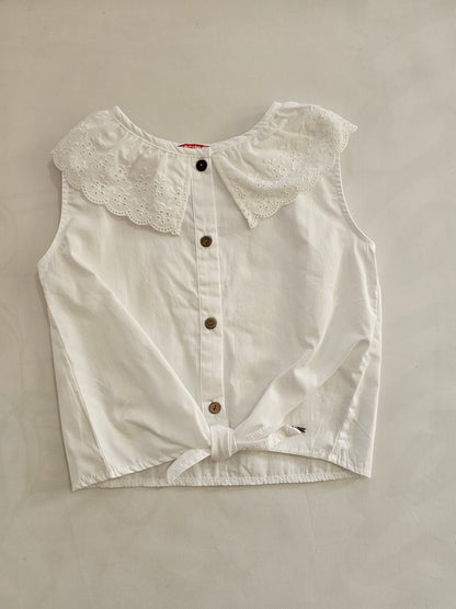 Blusa cuello perforado