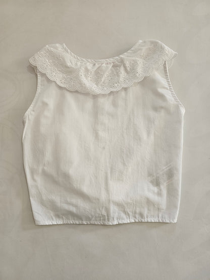 Blusa cuello perforado